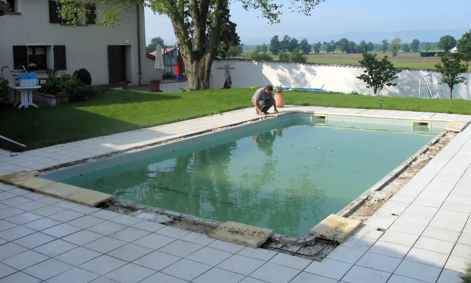 a pool being renovated in a garden